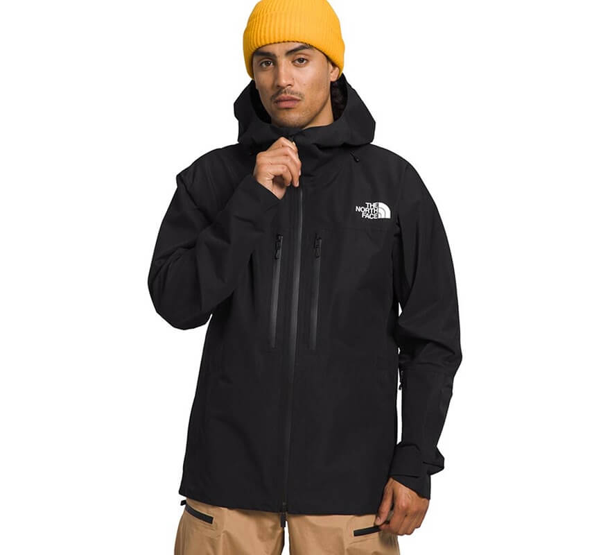 Man wearing a black The North Face hooded ski jacket.