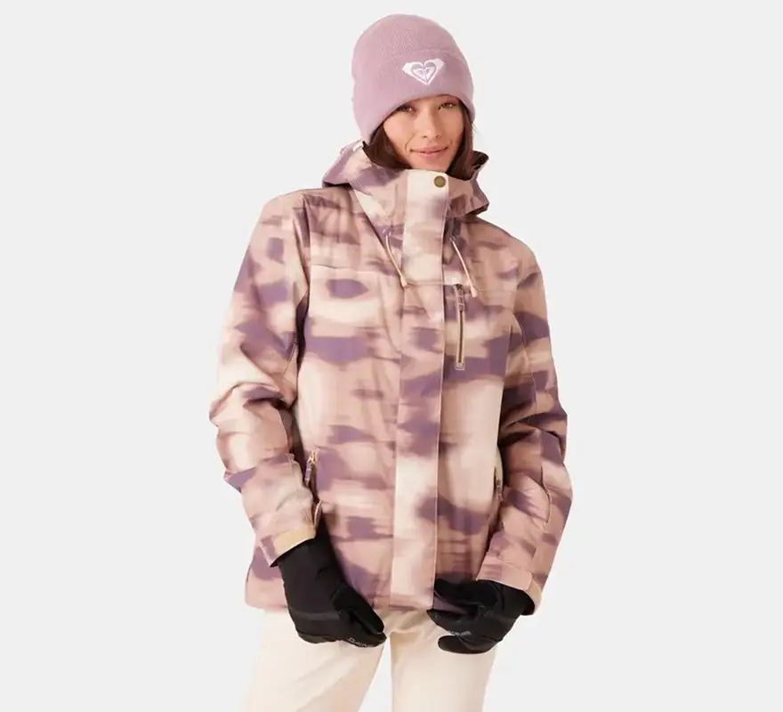 Woman wearing tie-dye print ski jacket and matching beanie